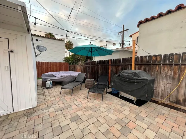 a view of a chairs and table in the patio