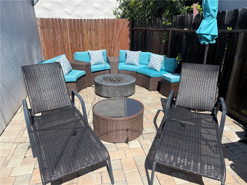 116 Avenida Serra, Unit 4 San Clemente, CA 92672 - Photo 19 of 23 a view of a chairs and table in the patio