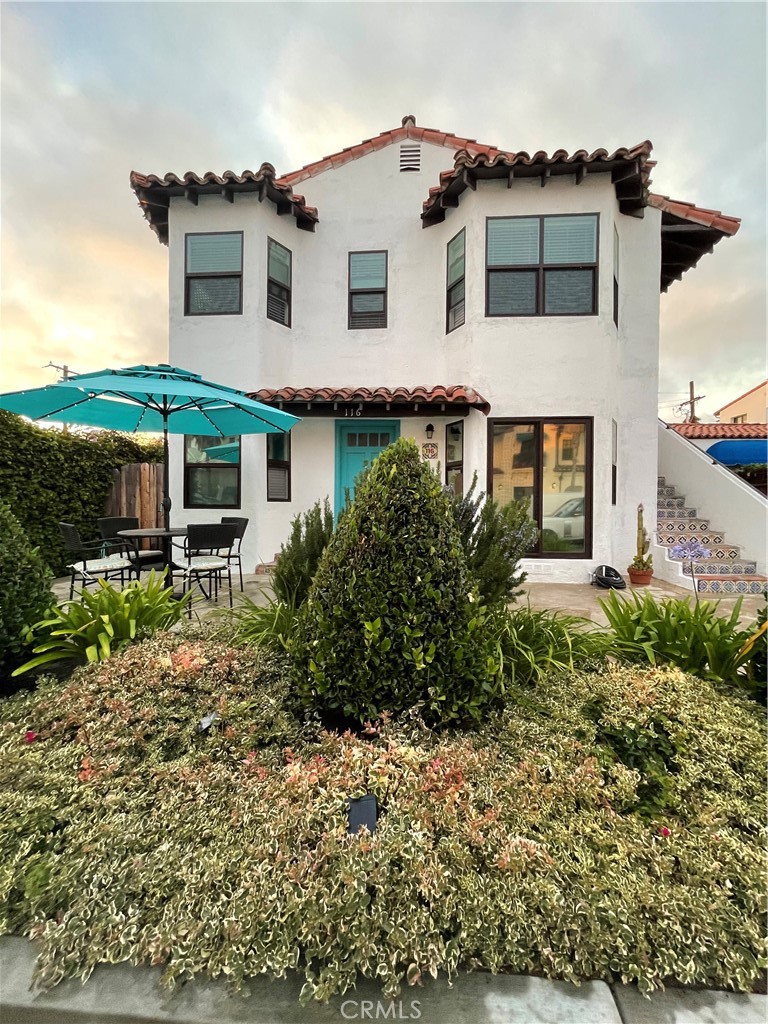 116 Avenida Serra, Unit 4 San Clemente, CA 92672 - Photo 22 of 23 a house that has a lot of plants in it