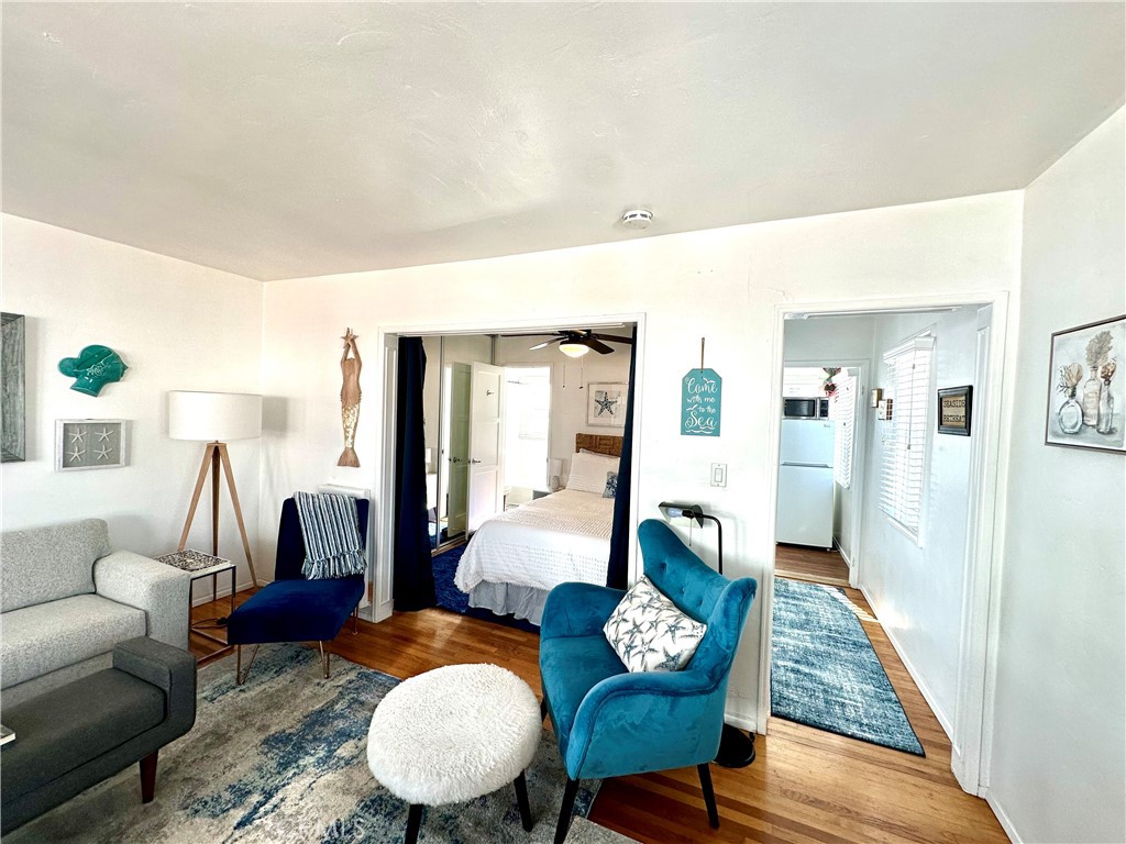 116 Avenida Serra, Unit 4 San Clemente, CA 92672 - Photo 3 of 23 a living room with furniture and wooden floor