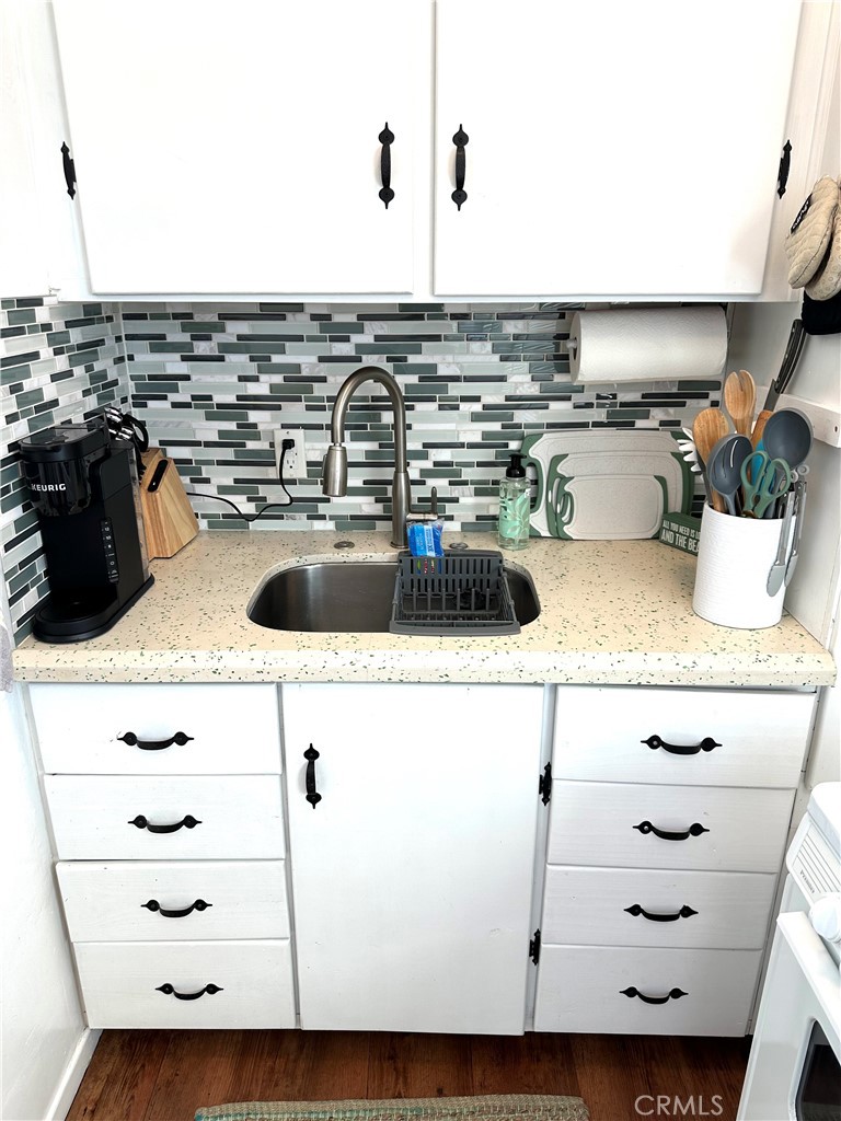 116 Avenida Serra, Unit 4 San Clemente, CA 92672 - Photo 6 of 23 a kitchen with a sink and a stove