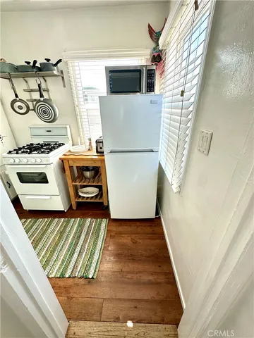 a kitchen with a stove and a window
