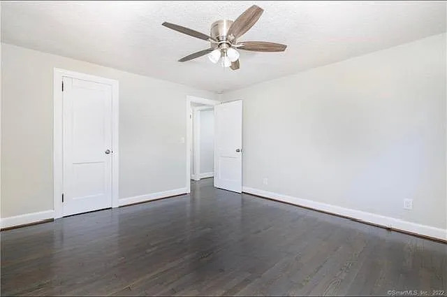 22 Fern Street Rocky Hill, CT 06067 - Photo 11 of 24 an empty room with wooden floor and ceiling fan