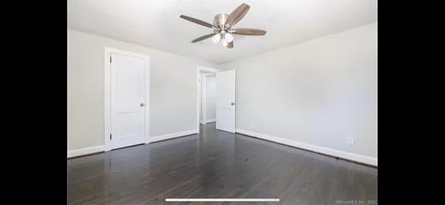 22 Fern Street Rocky Hill, CT 06067 - Photo 12 of 24 an empty room with wooden floor and ceiling fan