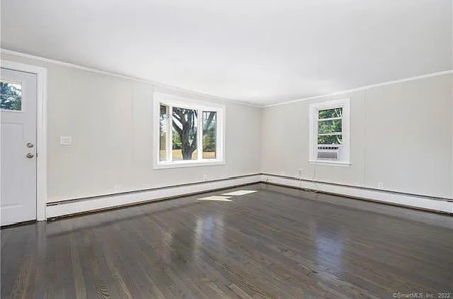 22 Fern Street Rocky Hill, CT 06067 - Photo 13 of 24 an empty room with wooden floor and windows