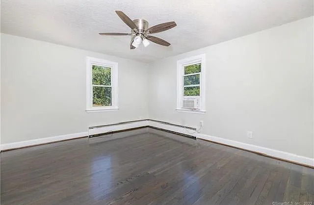 22 Fern Street Rocky Hill, CT 06067 - Photo 10 of 24 an empty room with wooden floor window and ceiling fan