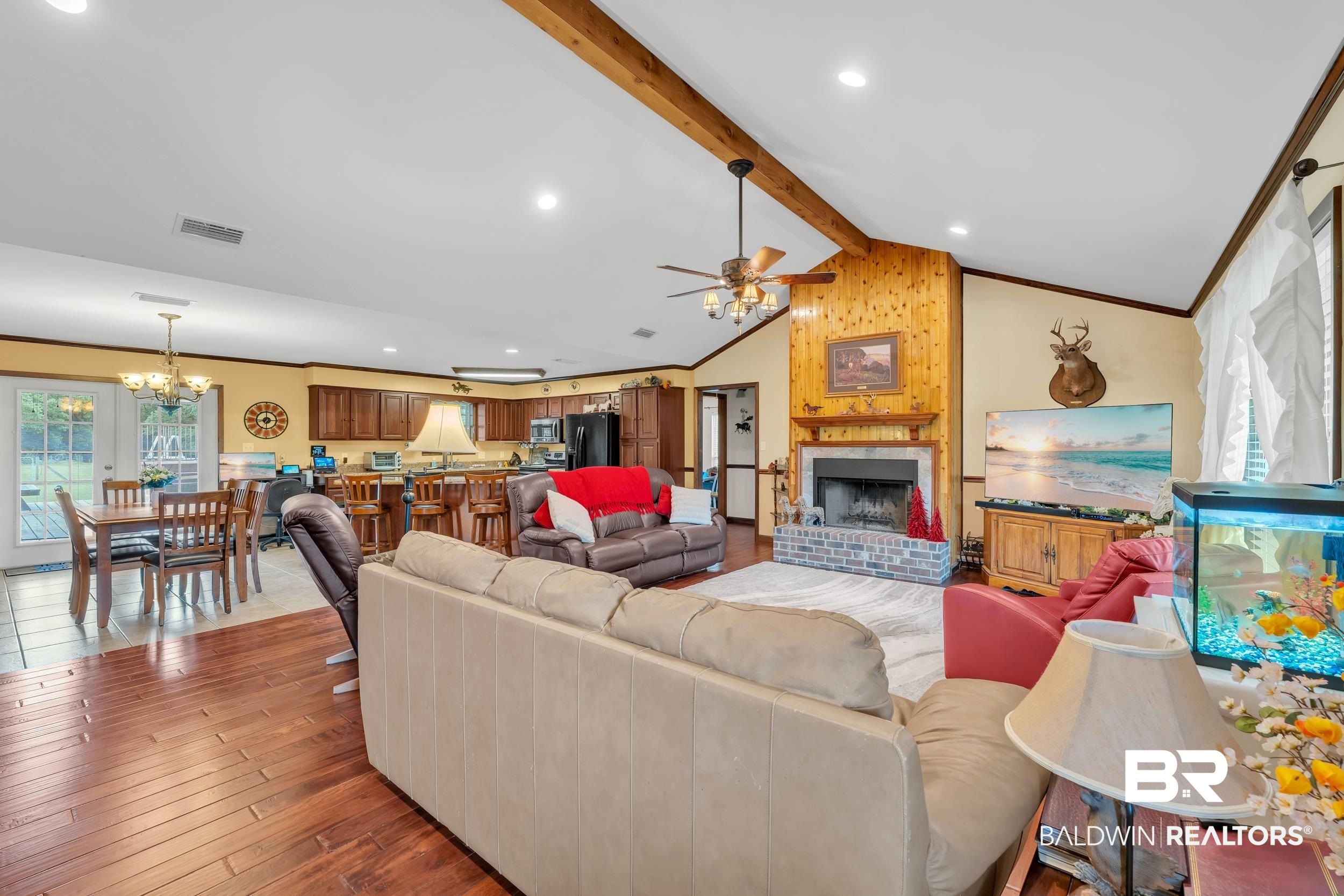 4062 River Road Theodore, AL 36582 - Photo 17 of 32 Living area featuring a chandelier, ceiling fan, a brick fireplace, hardwood / wood-style floors, and recessed lighting