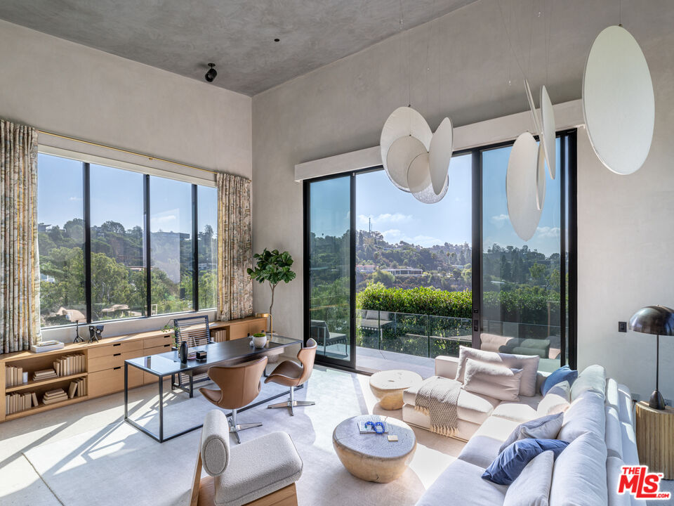 9152 Janice Place Beverly Hills, CA 90210 - Photo 11 of 18 a living room with furniture and a large window