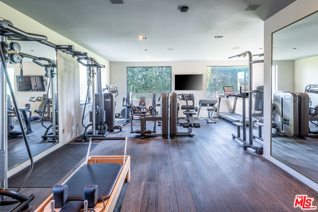 9152 Janice Place Beverly Hills, CA 90210 - Photo 14 of 18 a living room with lots of furniture and a flat screen tv