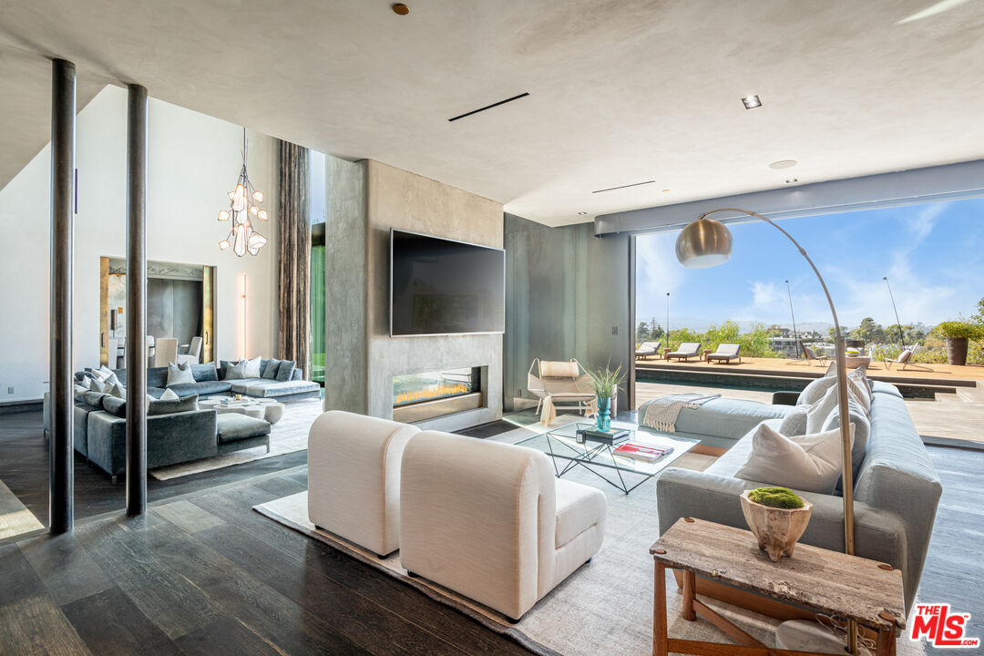 9152 Janice Place Beverly Hills, CA 90210 - Photo 3 of 18 a living room with furniture kitchen view and a large window