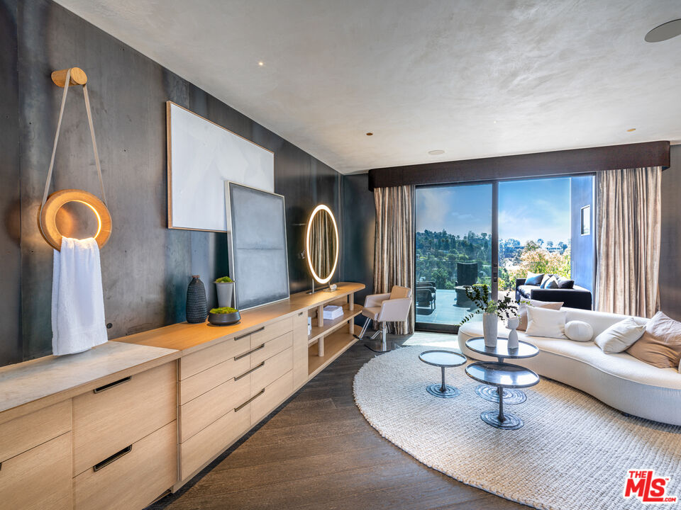 9152 Janice Place Beverly Hills, CA 90210 - Photo 7 of 18 a living room with furniture fireplace and window