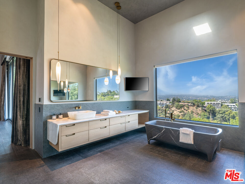 9152 Janice Place Beverly Hills, CA 90210 - Photo 8 of 18 a bathroom with a white bed couch and window