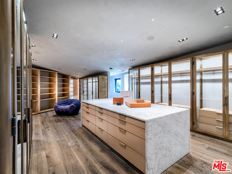 9152 Janice Place Beverly Hills, CA 90210 - Photo 10 of 18 a large bedroom with a bed and large windows