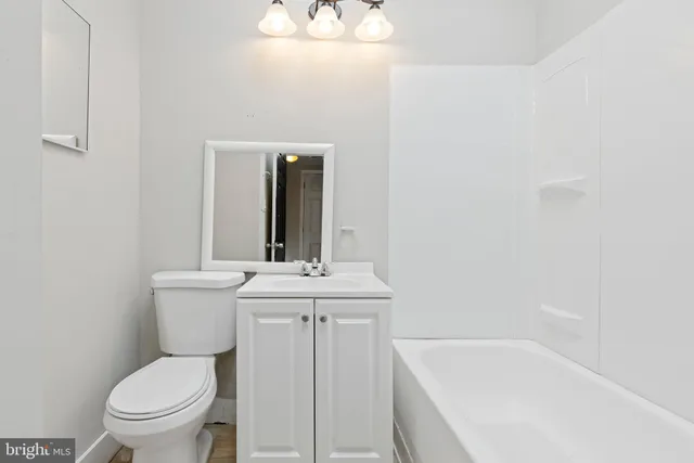 a bathroom with a sink a toilet and a bathtub