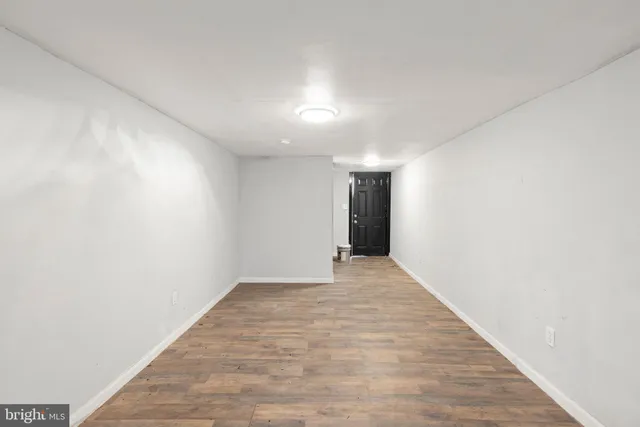 a room that has a dresser and a window in it