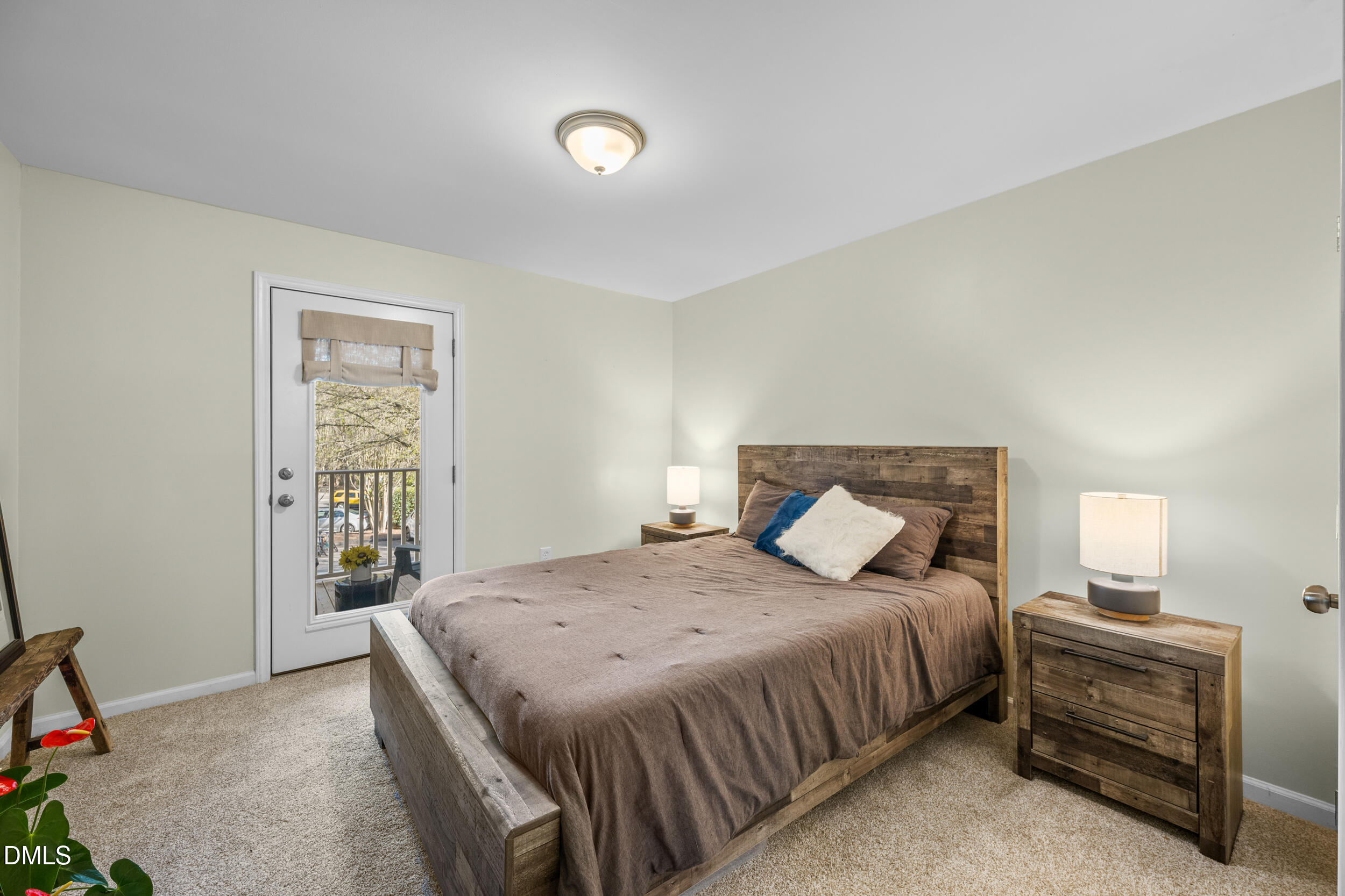 1312 Hillbrow Lane, Unit 203 Raleigh, NC 27615 - Photo 12 of 26 a bedroom with a bed and a window