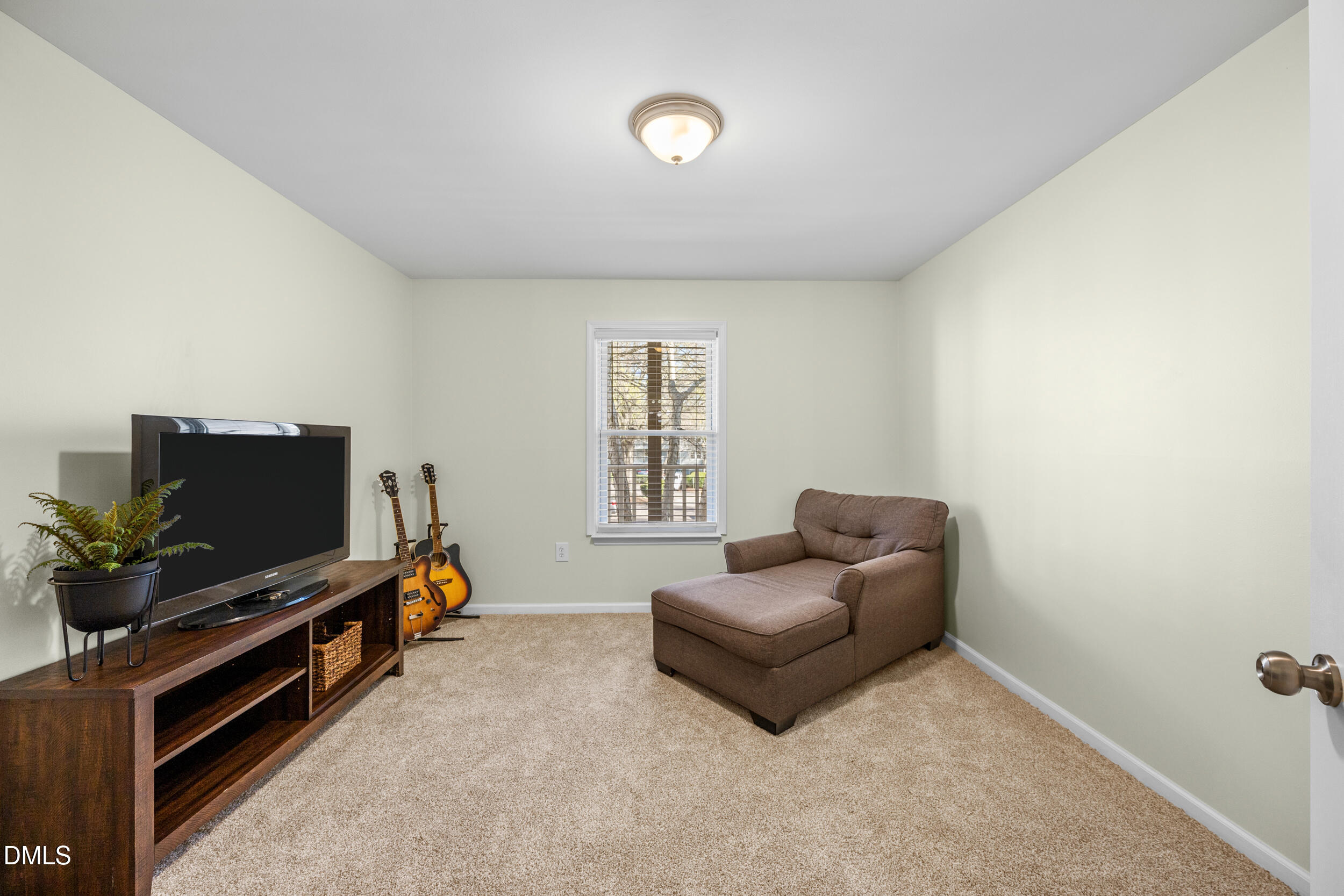 1312 Hillbrow Lane, Unit 203 Raleigh, NC 27615 - Photo 14 of 26 a living room with furniture and a flat screen tv