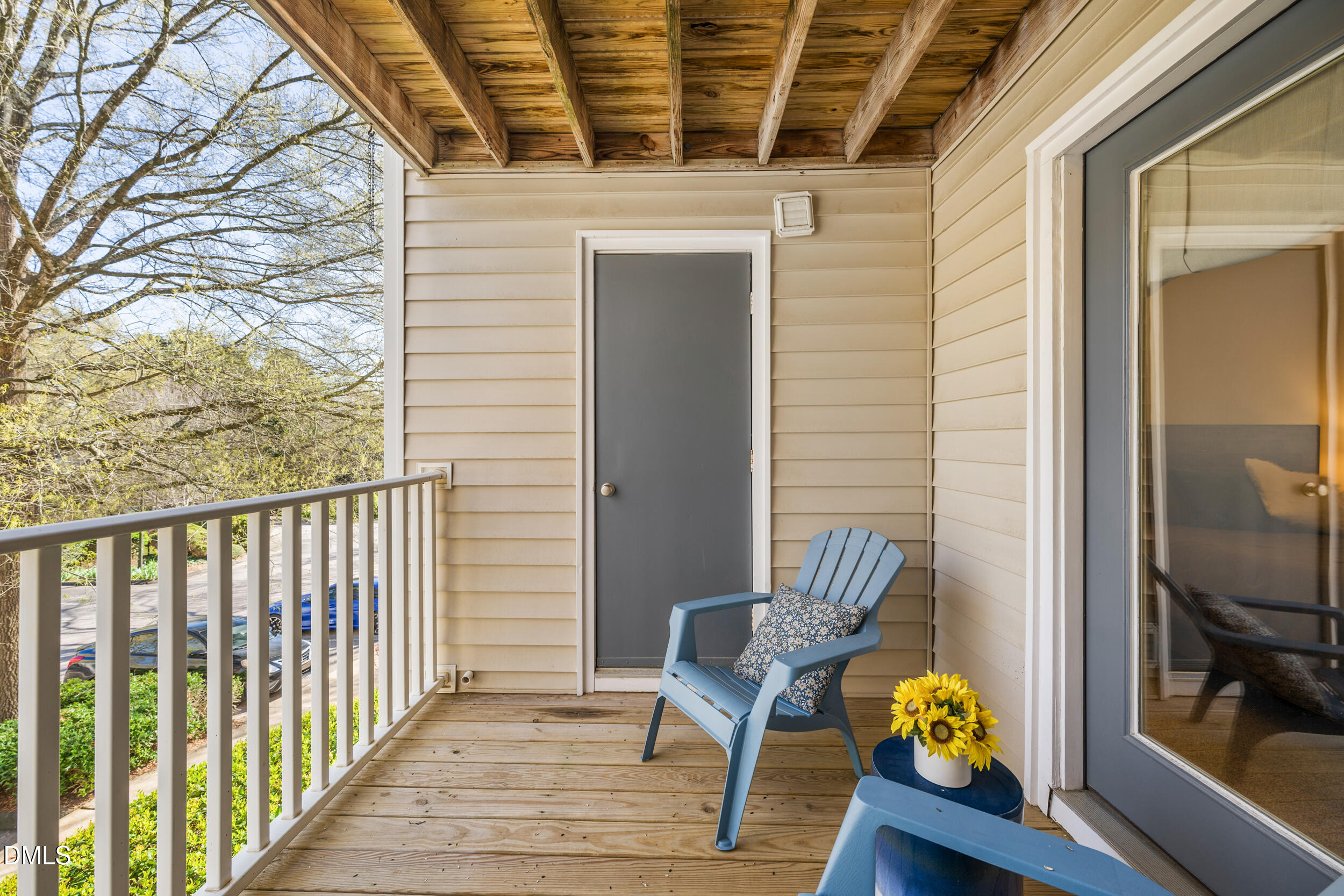 1312 Hillbrow Lane, Unit 203 Raleigh, NC 27615 - Photo 17 of 26 a view of a balcony with chair and the tables