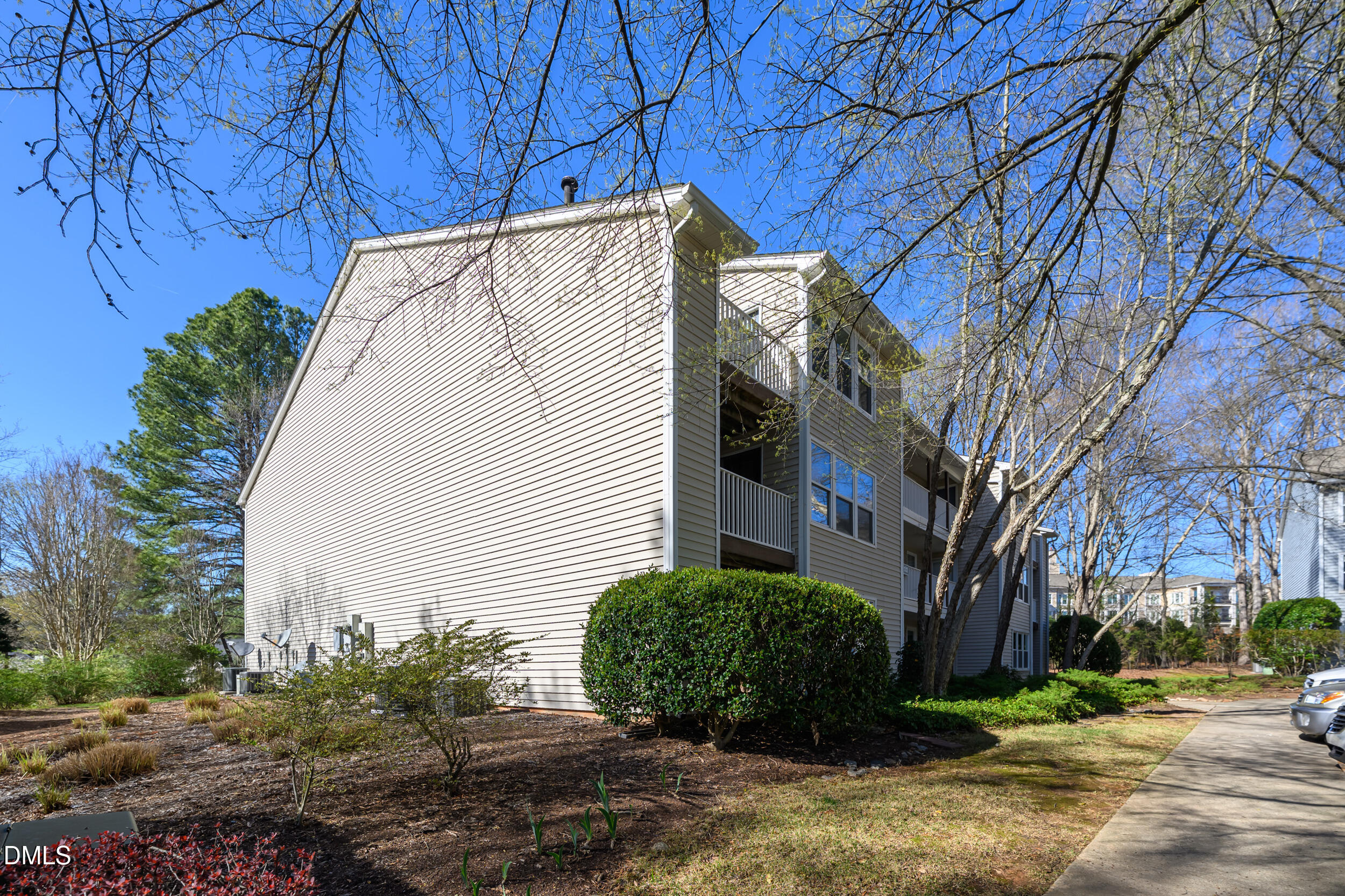 1312 Hillbrow Lane, Unit 203 Raleigh, NC 27615 - Photo 18 of 26 a view of a house with a yard