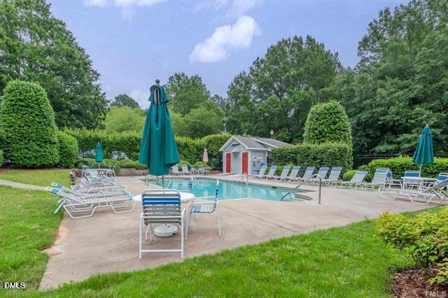 1312 Hillbrow Lane, Unit 203 Raleigh, NC 27615 - Photo 20 of 26 a view of a house with a yard and sitting area