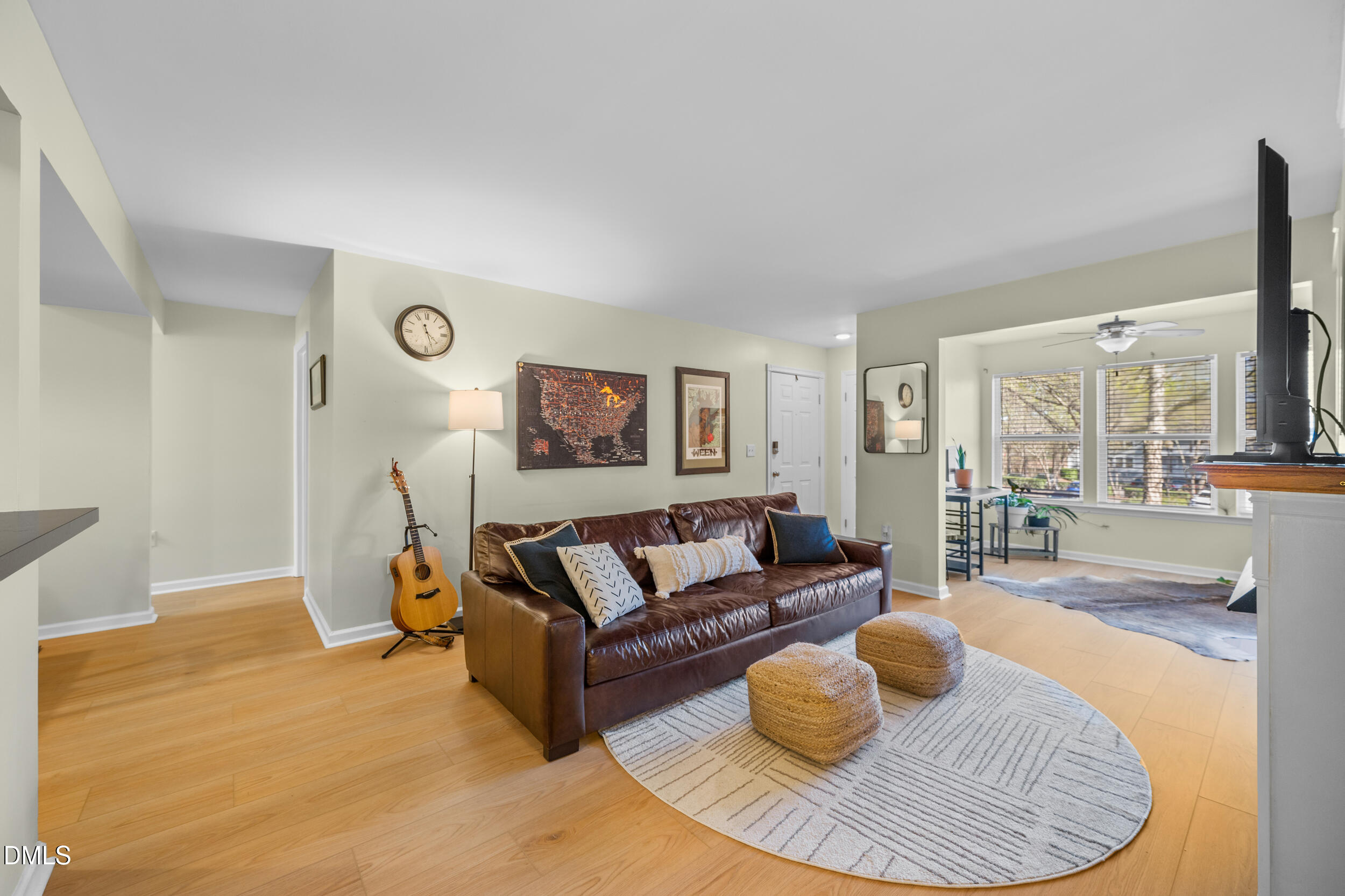 1312 Hillbrow Lane, Unit 203 Raleigh, NC 27615 - Photo 5 of 26 a living room with furniture and a fireplace