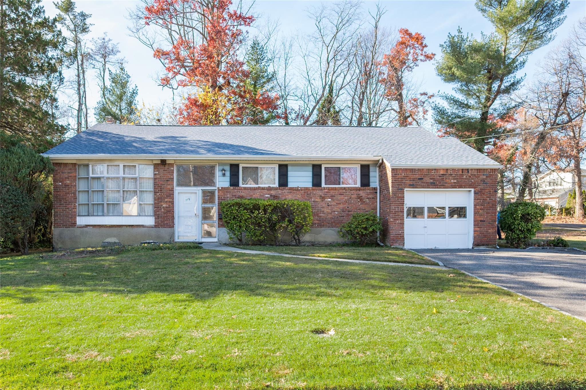 119 Reed Drive Roslyn, NY 11576 - Photo 1 of 10 a house view with a garden space