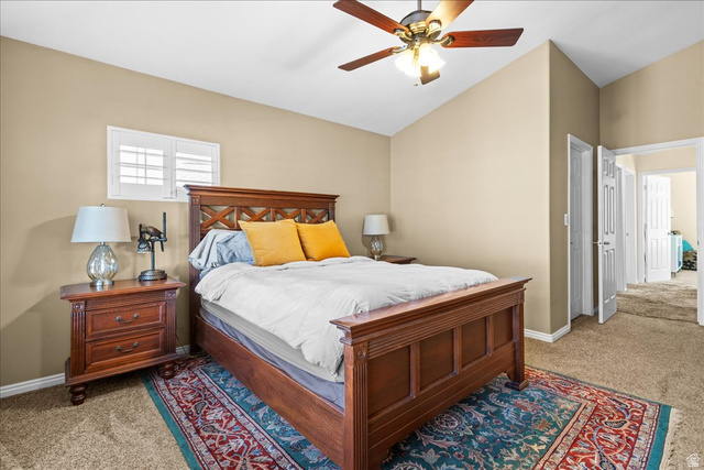7824 South Sequoia Tree Lane Sandy, UT 84094 - Photo 20 of 43 Bedroom featuring light carpet, vaulted ceiling, and ceiling fan