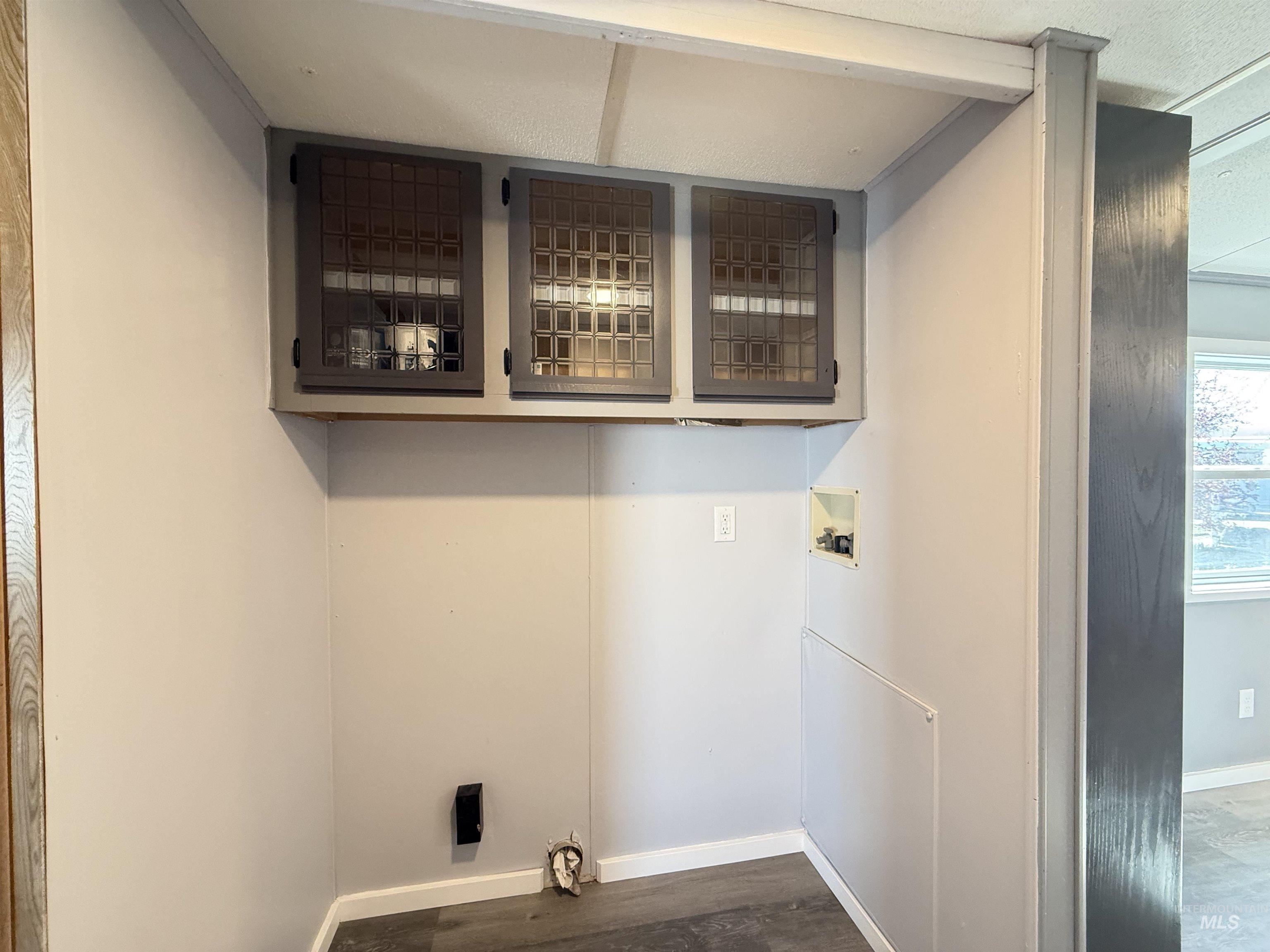 2015 6th Avenue, Unit 321 Clarkston, WA 99403 - Photo 21 of 34 Laundry area with washer hookup and dark wood-style flooring