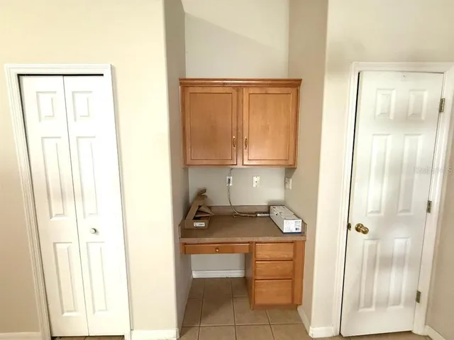 a room with a cabinets and appliances