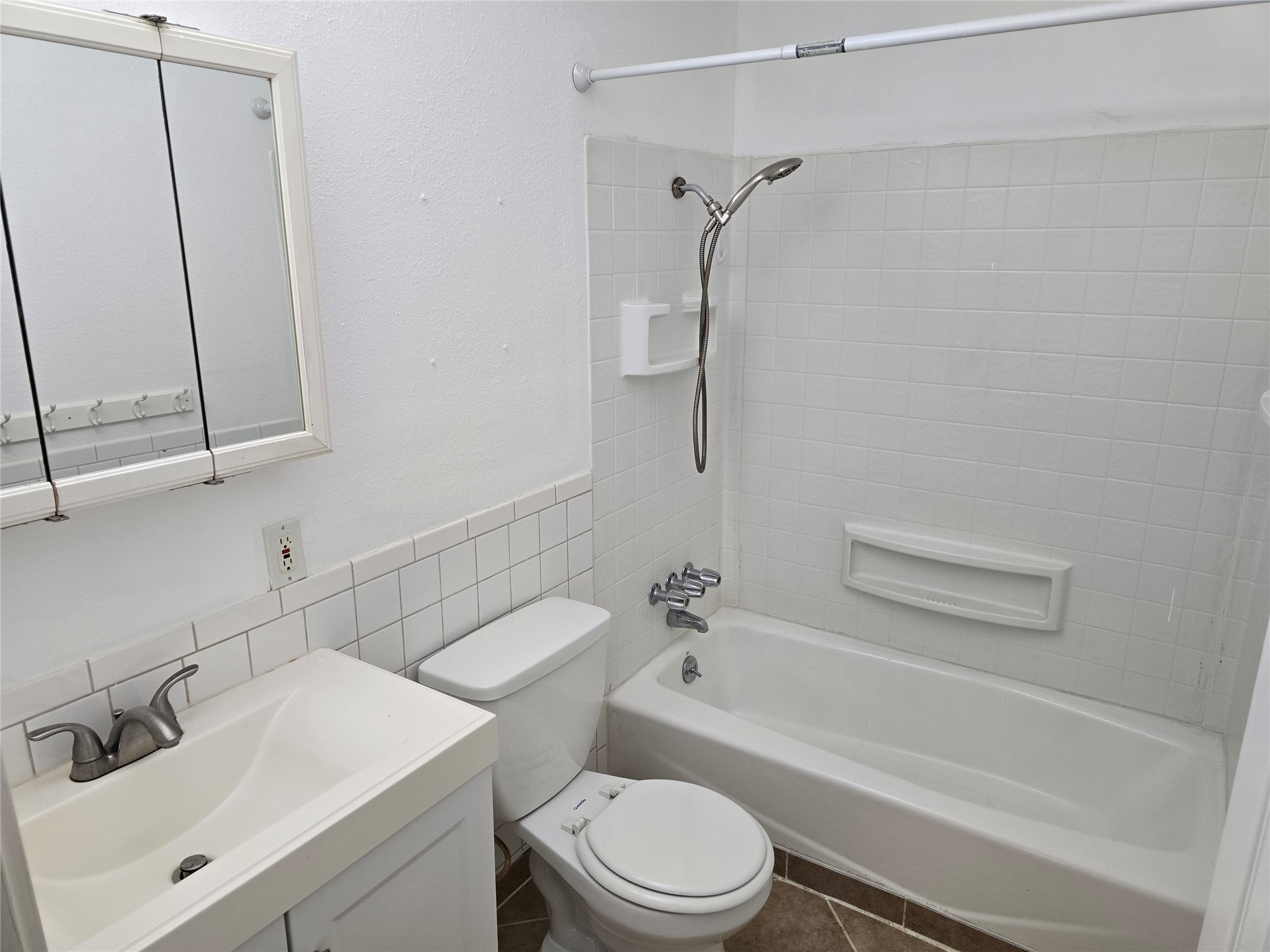 3619 Washington Street Pasadena, TX 77503 - Photo 6 of 16 a bathroom with a sink toilet and shower