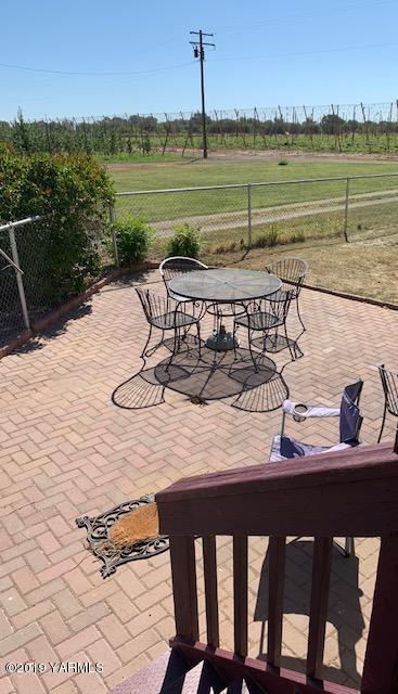 341 Heikle Road Wapato, WA 98951 - Photo 11 of 29 a view of a lake with a table and chairs