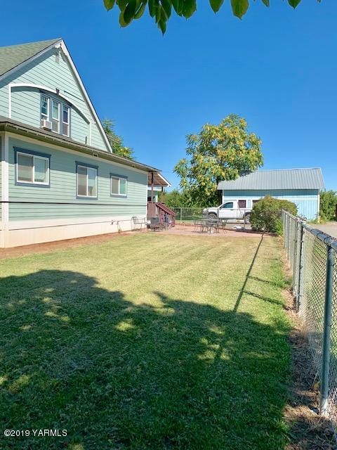 341 Heikle Road Wapato, WA 98951 - Photo 5 of 29 a view of swimming pool with seating area and trees in the background