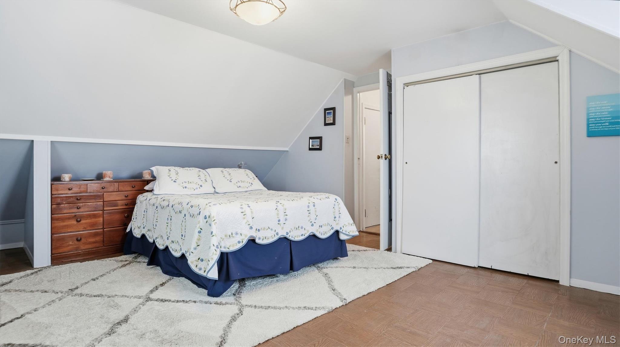 83-57 251st Street Queens, NY 11426 - Photo 11 of 14 a bedroom with a bed and walk in closet