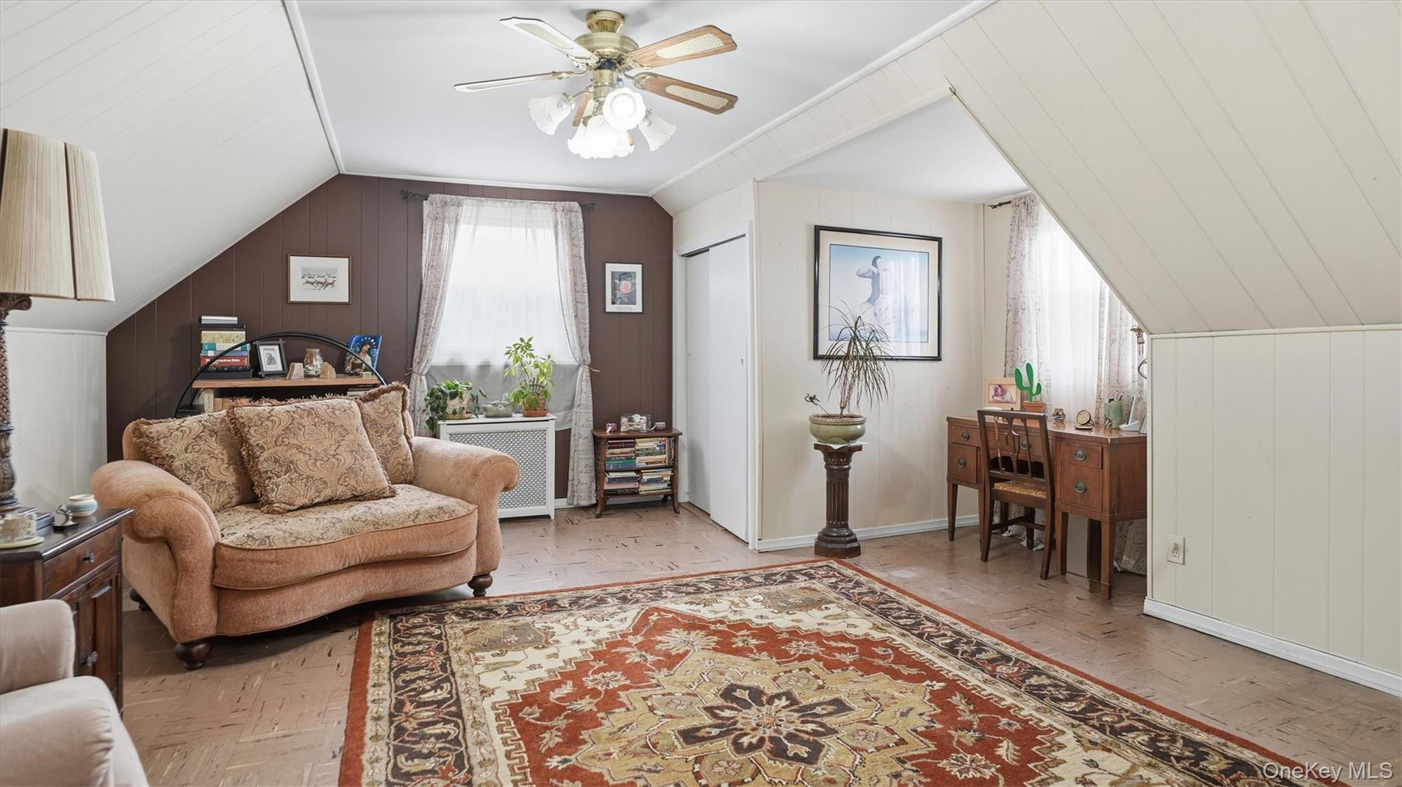 83-57 251st Street Queens, NY 11426 - Photo 12 of 14 a living room with furniture and a rug