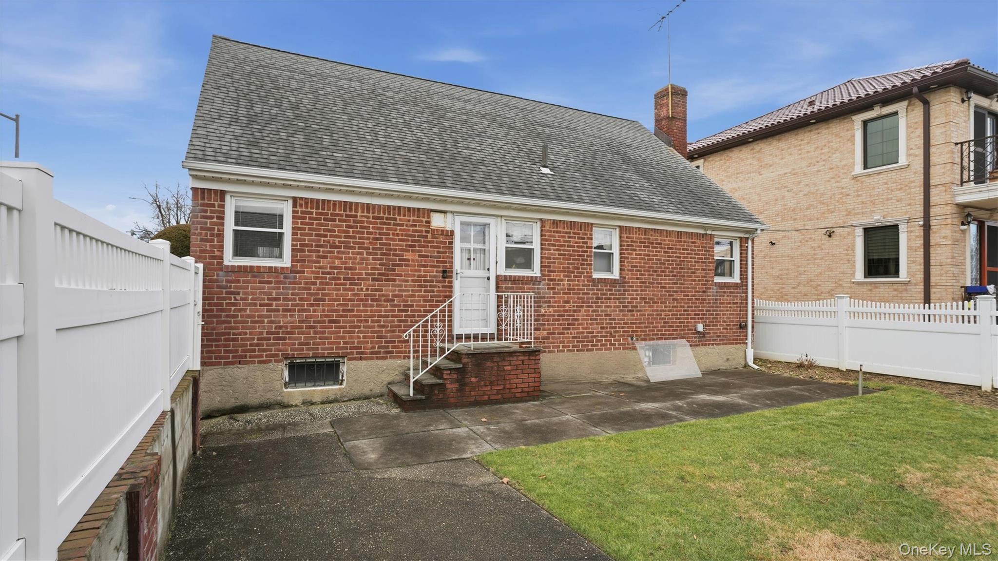 83-57 251st Street Queens, NY 11426 - Photo 14 of 14 a front view of a house with a yard