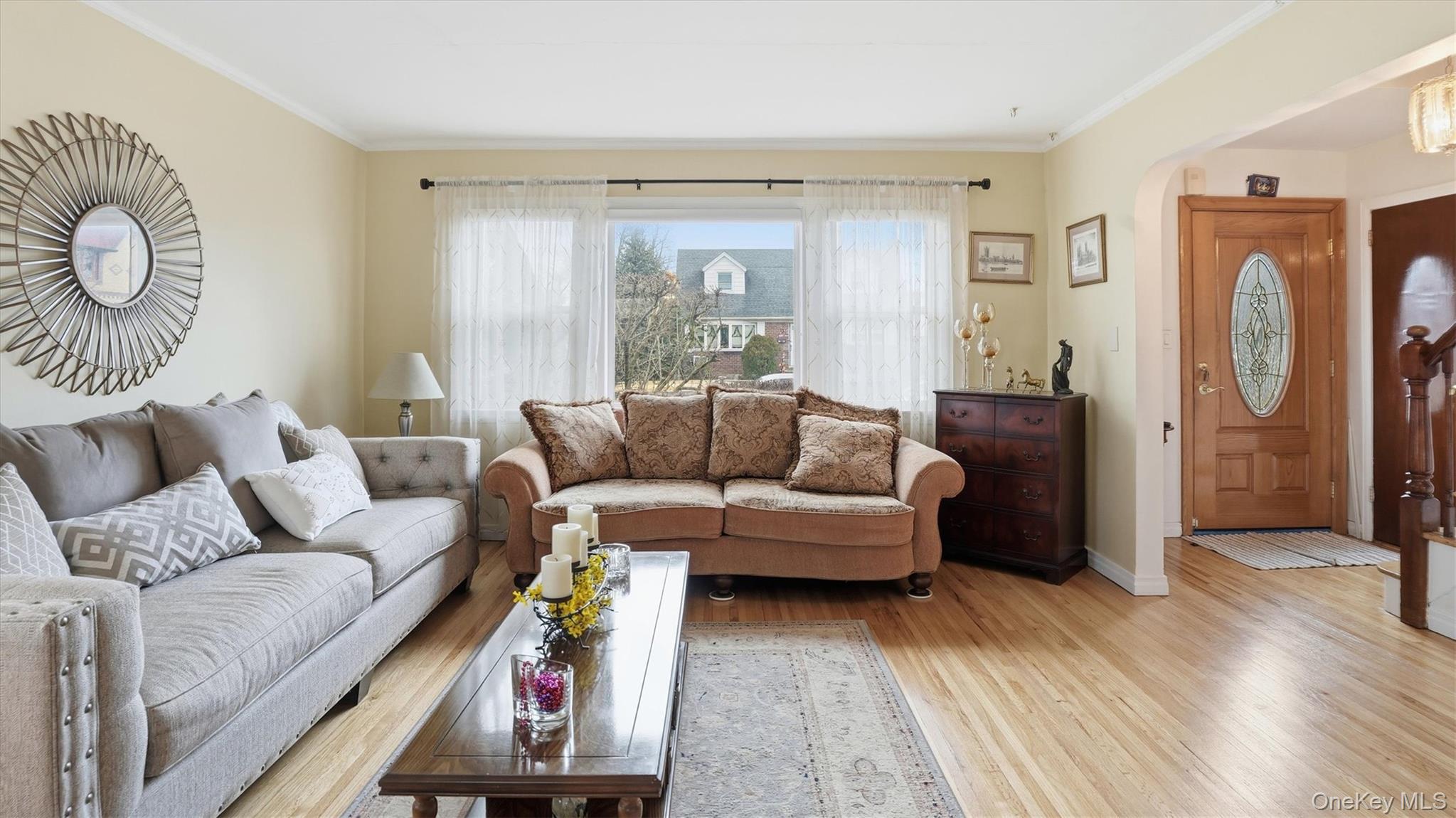 83-57 251st Street Queens, NY 11426 - Photo 3 of 14 a living room with furniture and a window