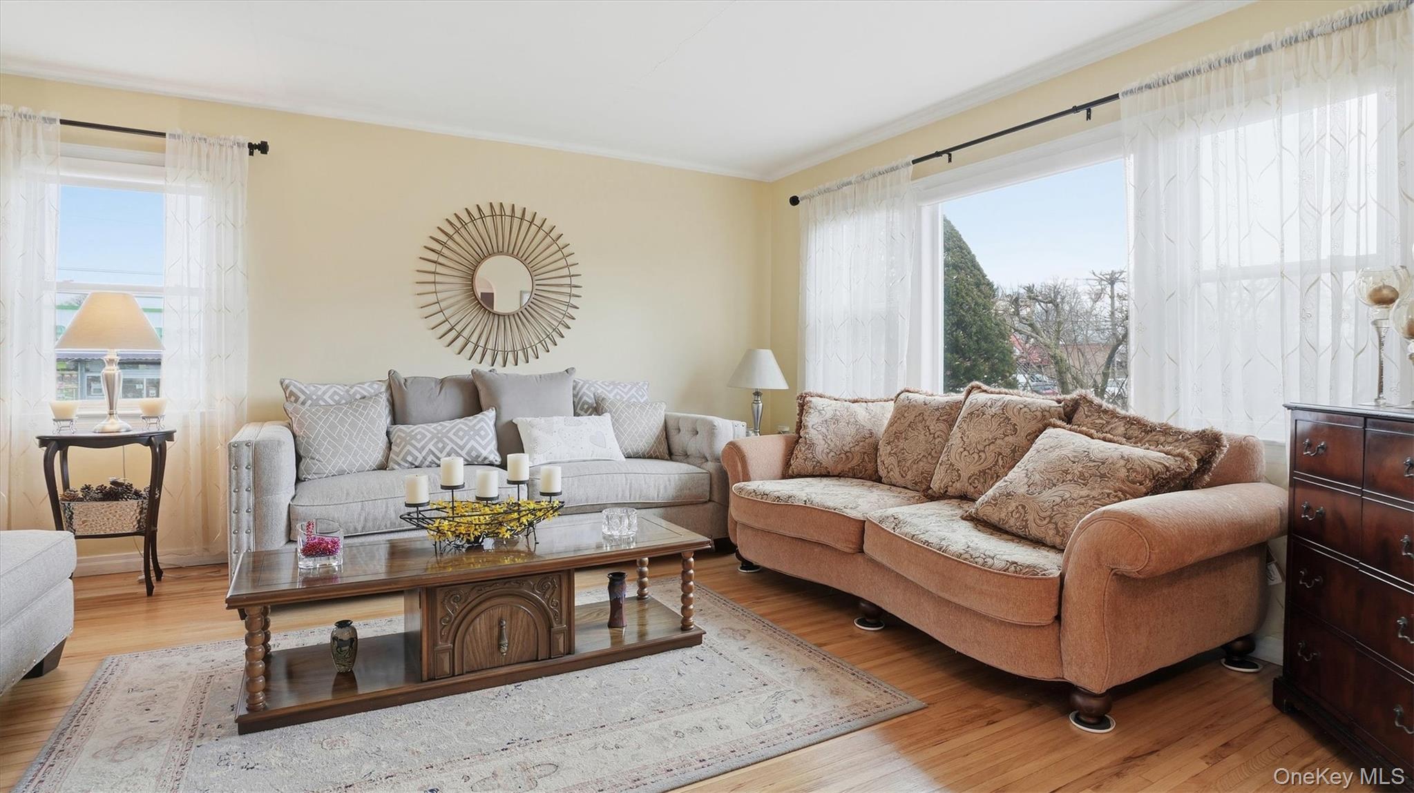 83-57 251st Street Queens, NY 11426 - Photo 4 of 14 a living room with furniture and a window