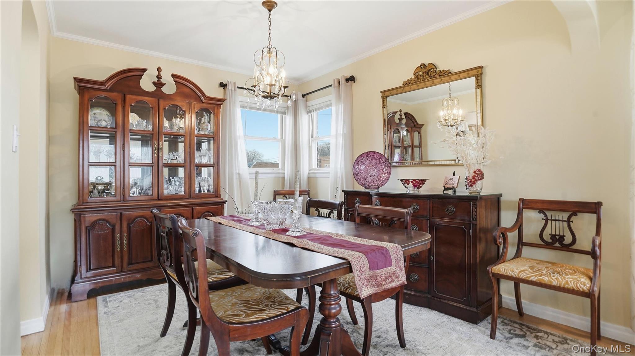 83-57 251st Street Queens, NY 11426 - Photo 5 of 14 a view of a dining room with furniture and chandelier