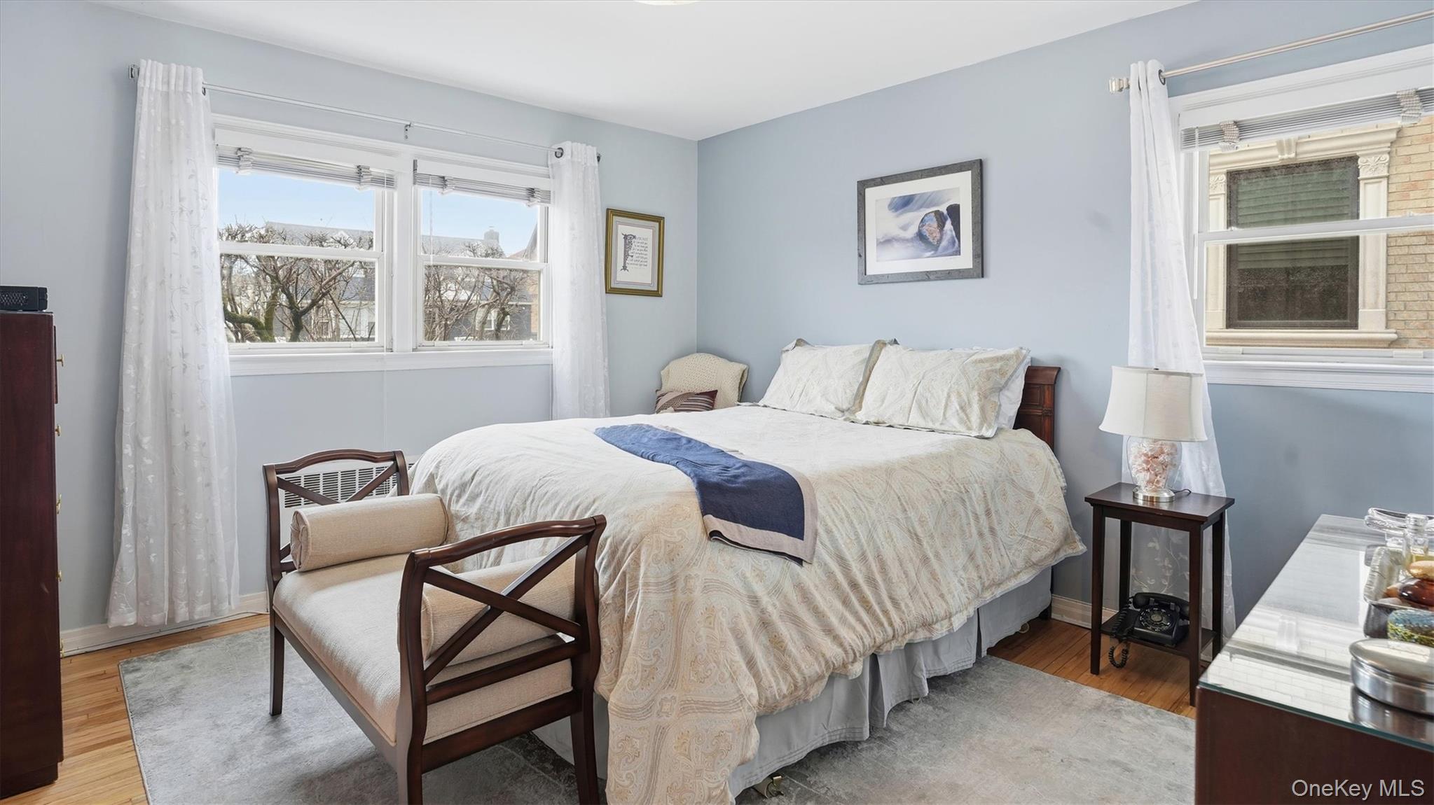 83-57 251st Street Queens, NY 11426 - Photo 8 of 14 a bedroom with a bed and a window