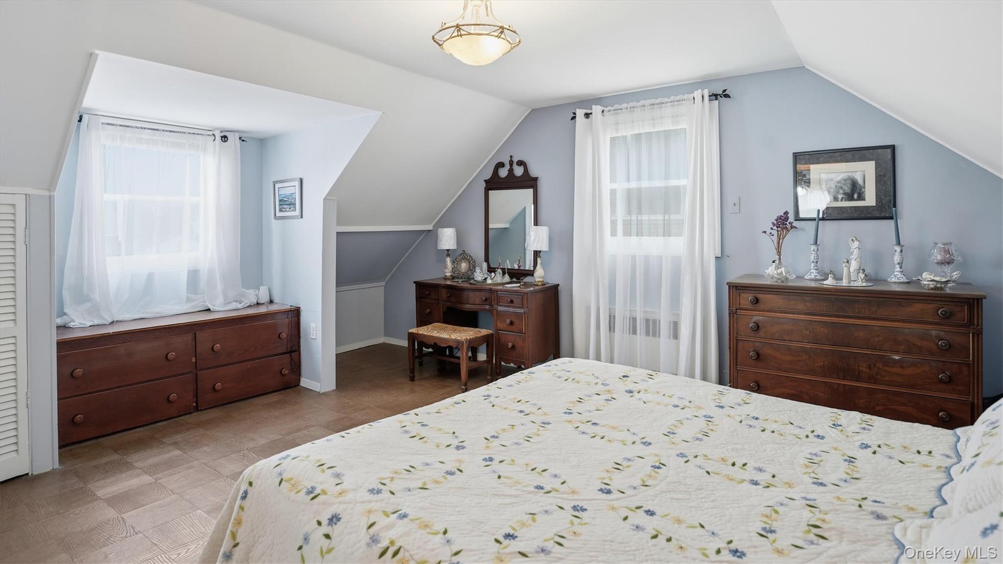 83-57 251st Street Queens, NY 11426 - Photo 10 of 14 a bedroom with a bed and a dresser