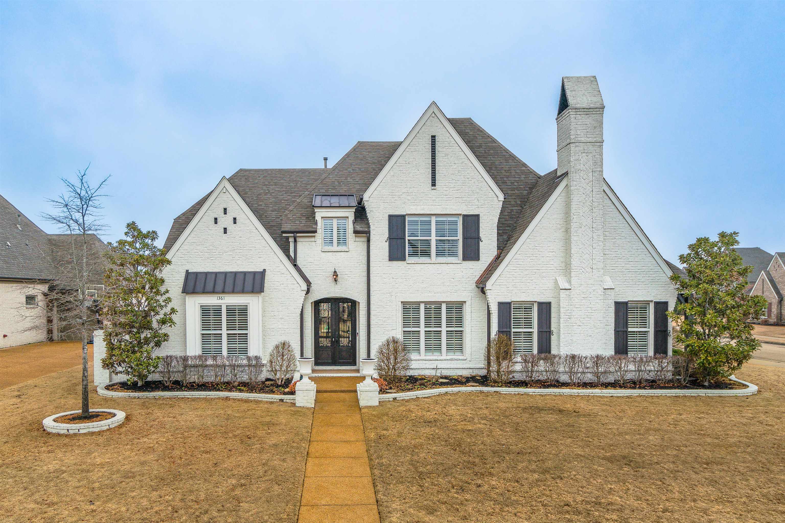 a front view of a house with a yard