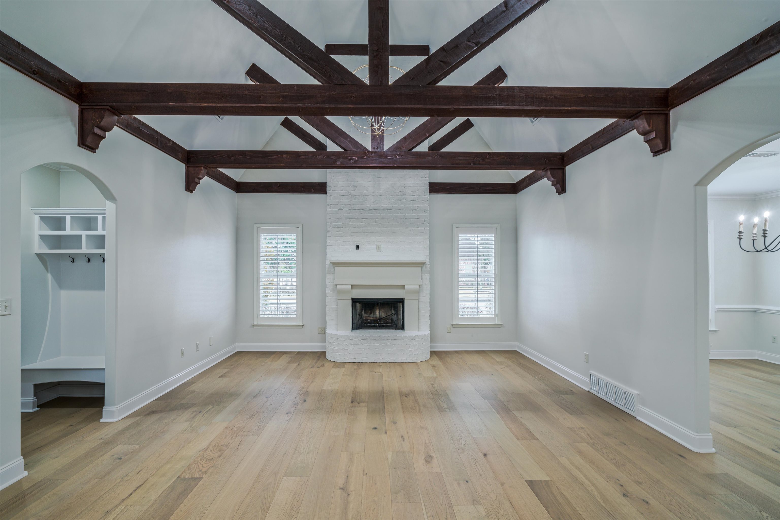1361 Conser Street Collierville, TN 38017 - Photo 11 of 25 a view of an empty room with wooden floor fireplace and a window