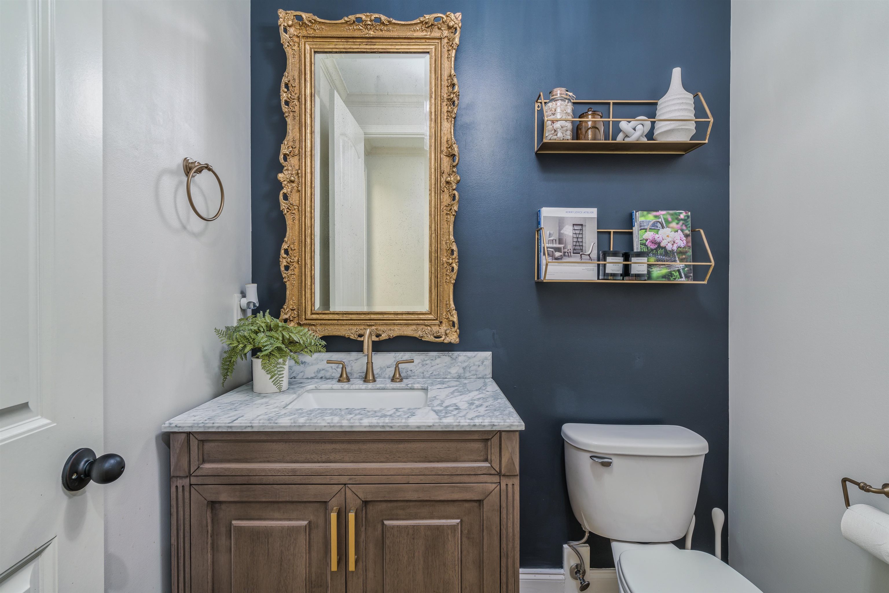 1361 Conser Street Collierville, TN 38017 - Photo 12 of 25 a bathroom with a granite countertop toilet sink and mirror