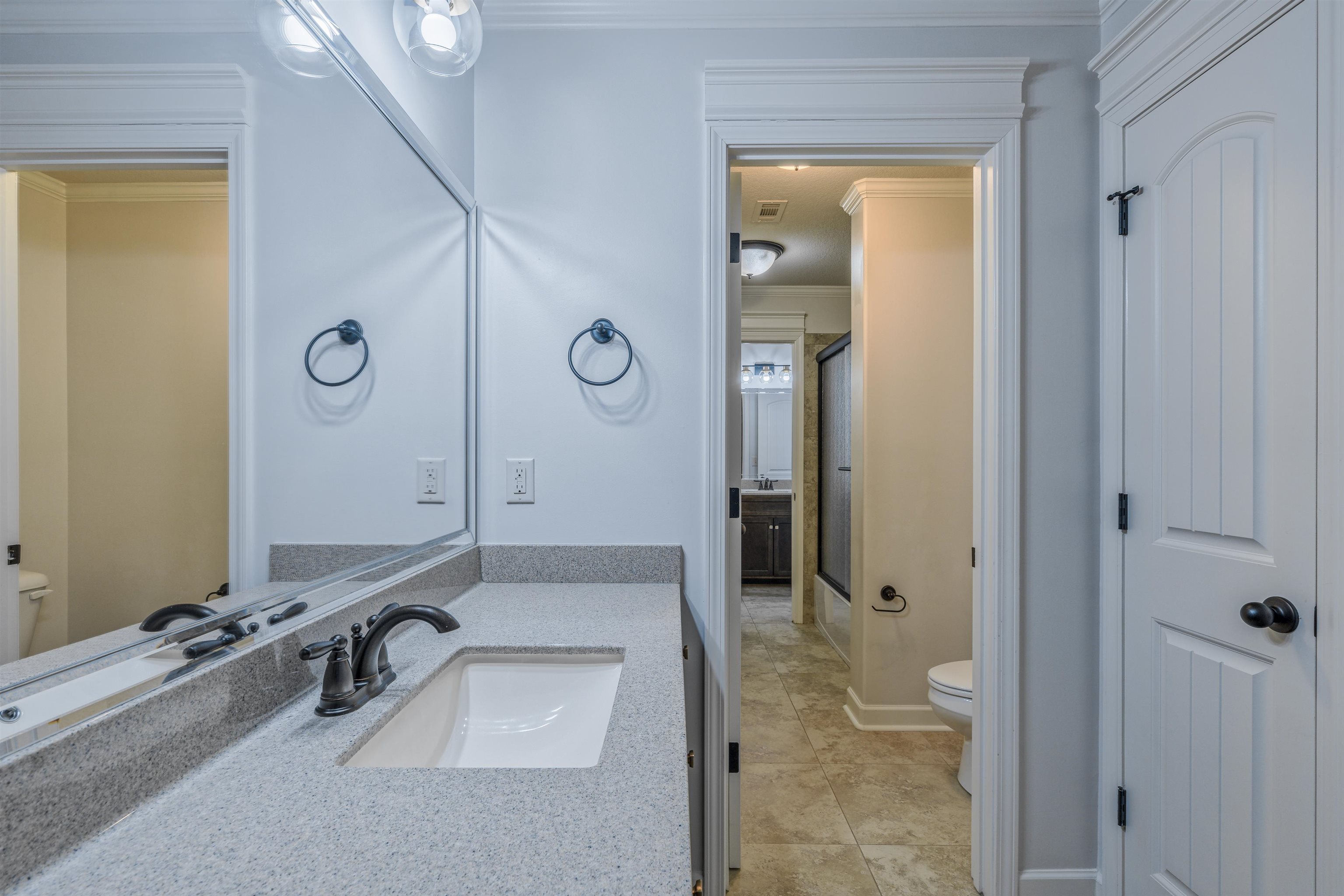 1361 Conser Street Collierville, TN 38017 - Photo 19 of 25 a bathroom with a sink and a mirror