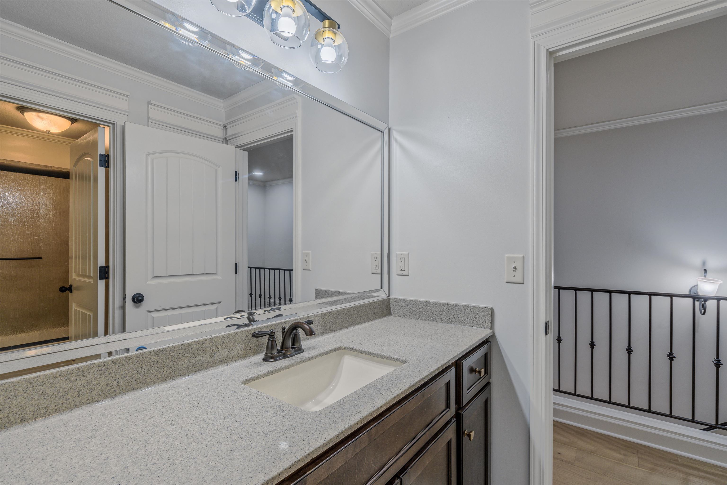 1361 Conser Street Collierville, TN 38017 - Photo 22 of 25 a bathroom with a sink and a mirror