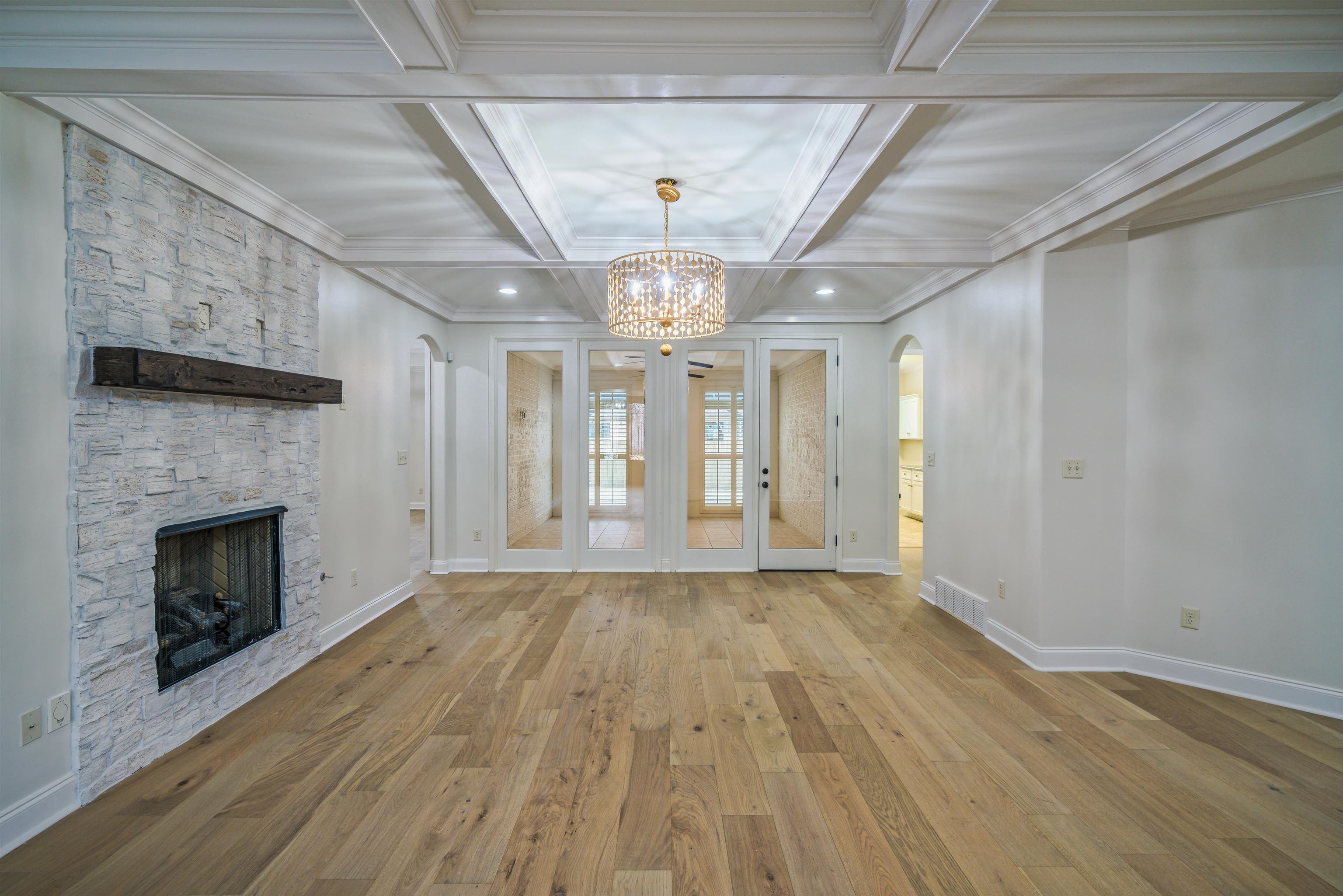 1361 Conser Street Collierville, TN 38017 - Photo 4 of 25 a view of empty room with wooden floor and fireplace