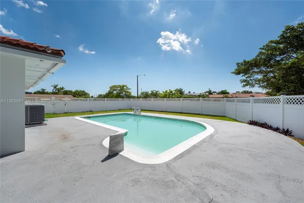 a view of a swimming pool and outdoor space