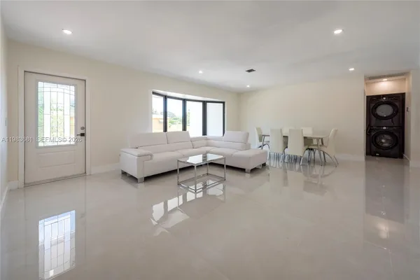 a living room with furniture and a window