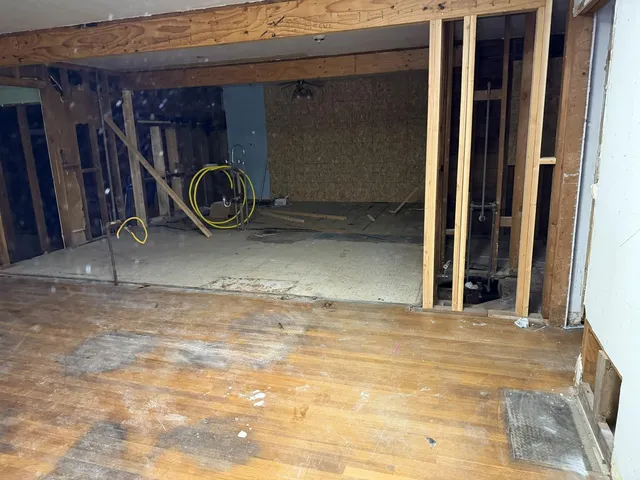 a view of a room with wooden walls