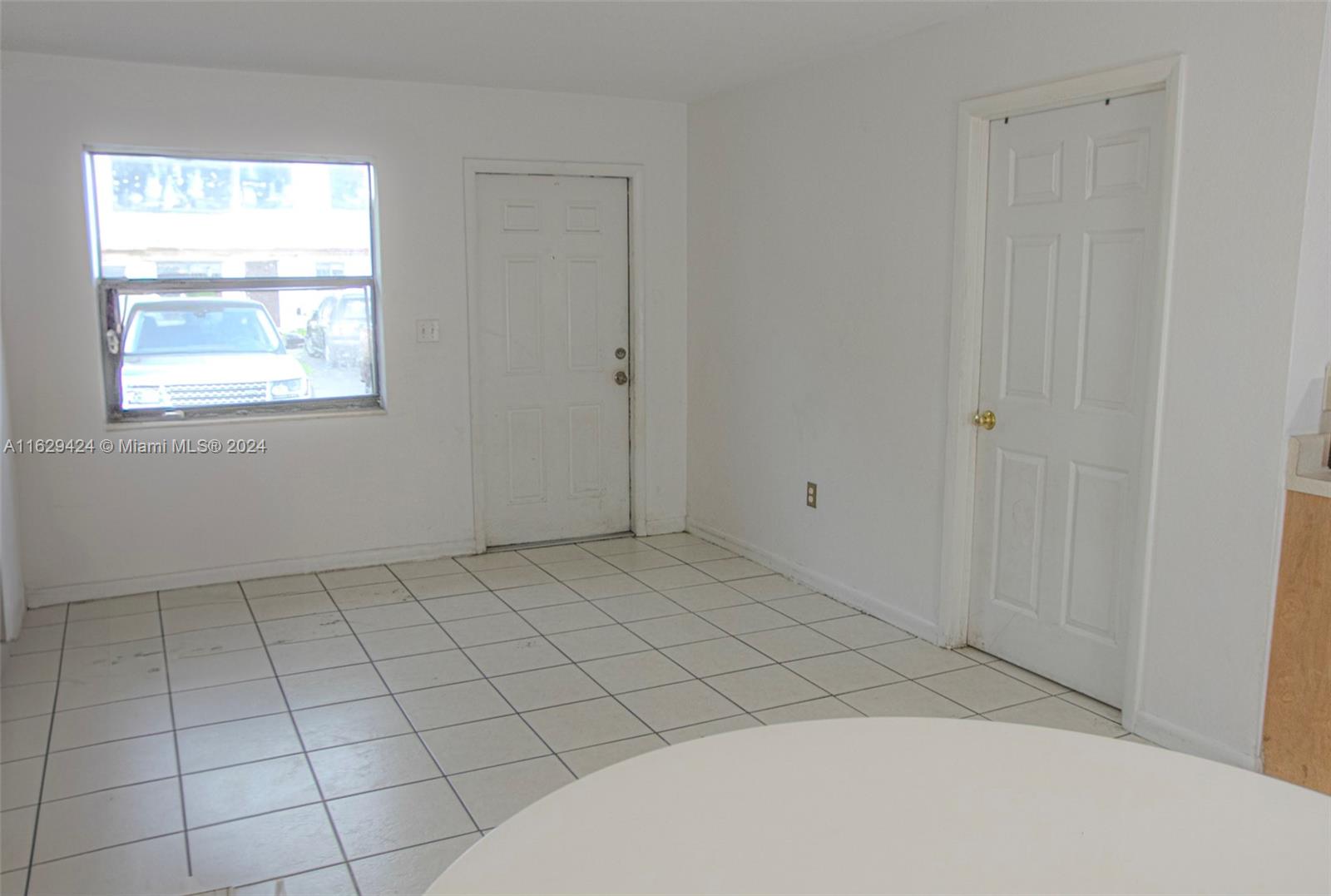 14316 Southwest 283rd Street, Unit 14316 Homestead, FL 33033 - Photo 4 of 6 a view of an empty room and window